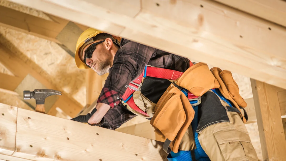 Experienced site carpenter carrying out advanced carpentry work on a construction site