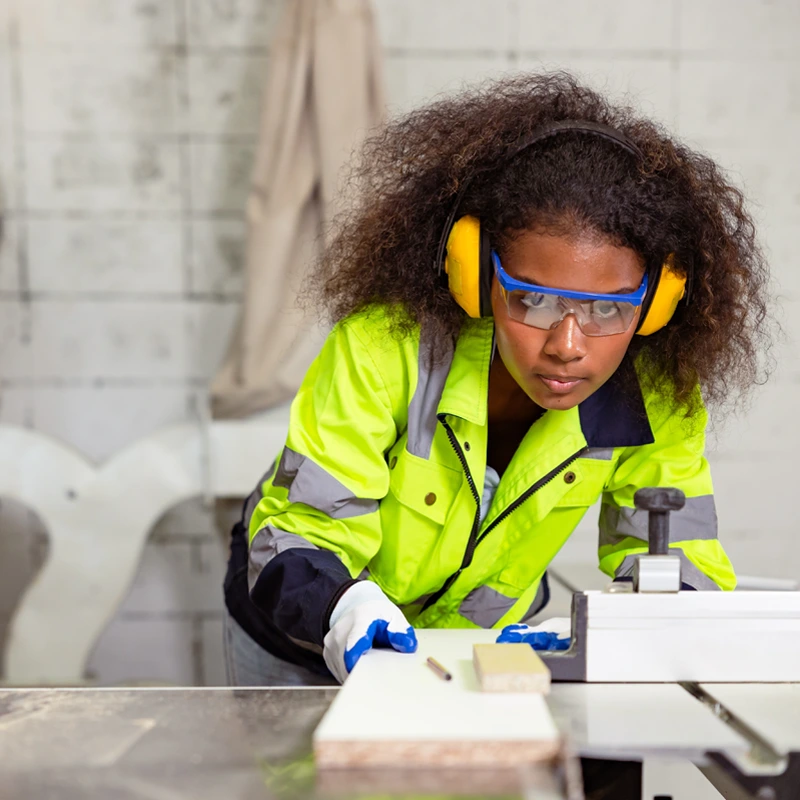 Worker Using A Table Saw
