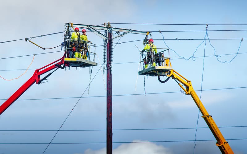 Men working safely on power lines